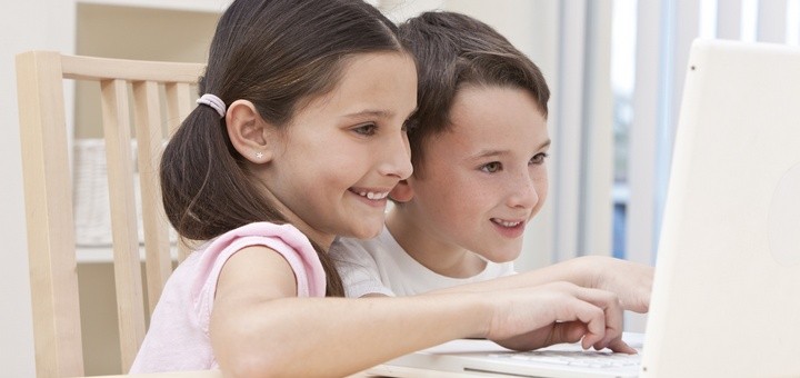 Boy  Girl Children Using Laptop Computer at Home