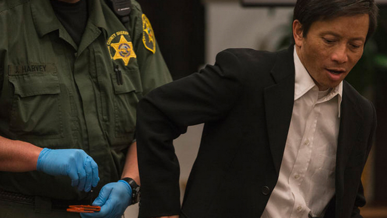 Gianni Anthony Van is released from handcuffs as he arrives at court in Orange County for his murder trial. (Credit: Robert Gauthier / Los Angeles Times)