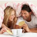 A couple enjoying breakfast in bed